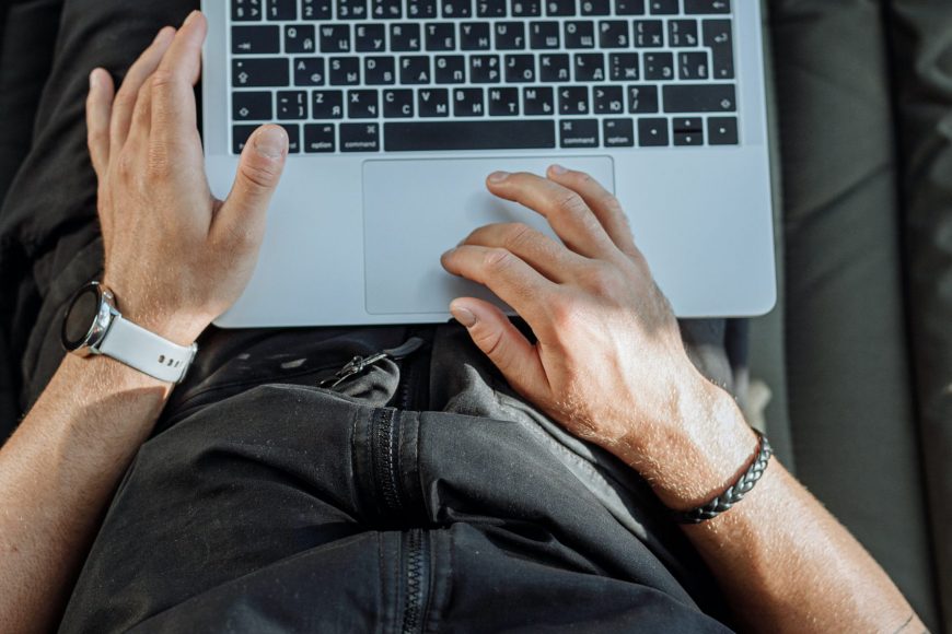 Free A Person Working on His Laptop Stock Photo